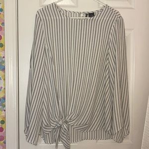 Long sleeve blouse with slits down the sleeves.